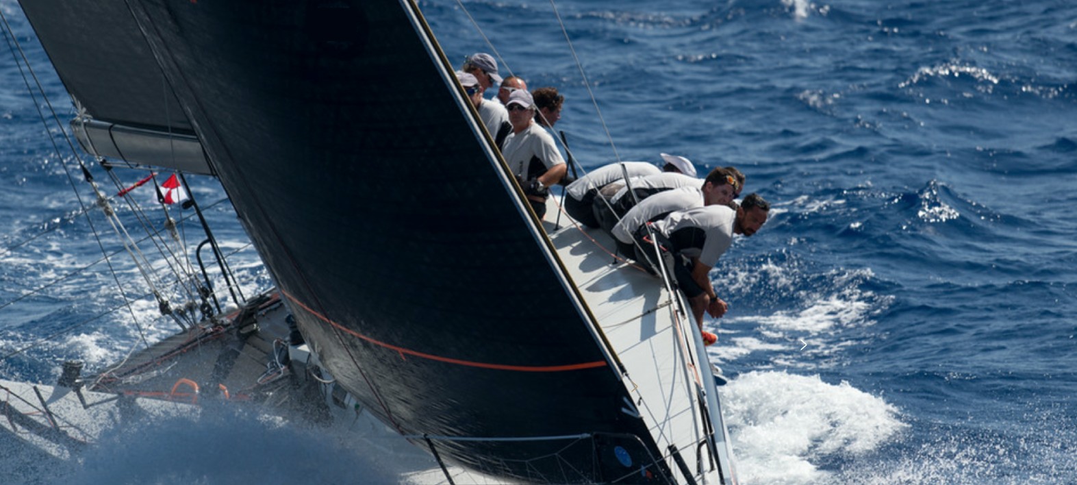 Sailing team working together at sea